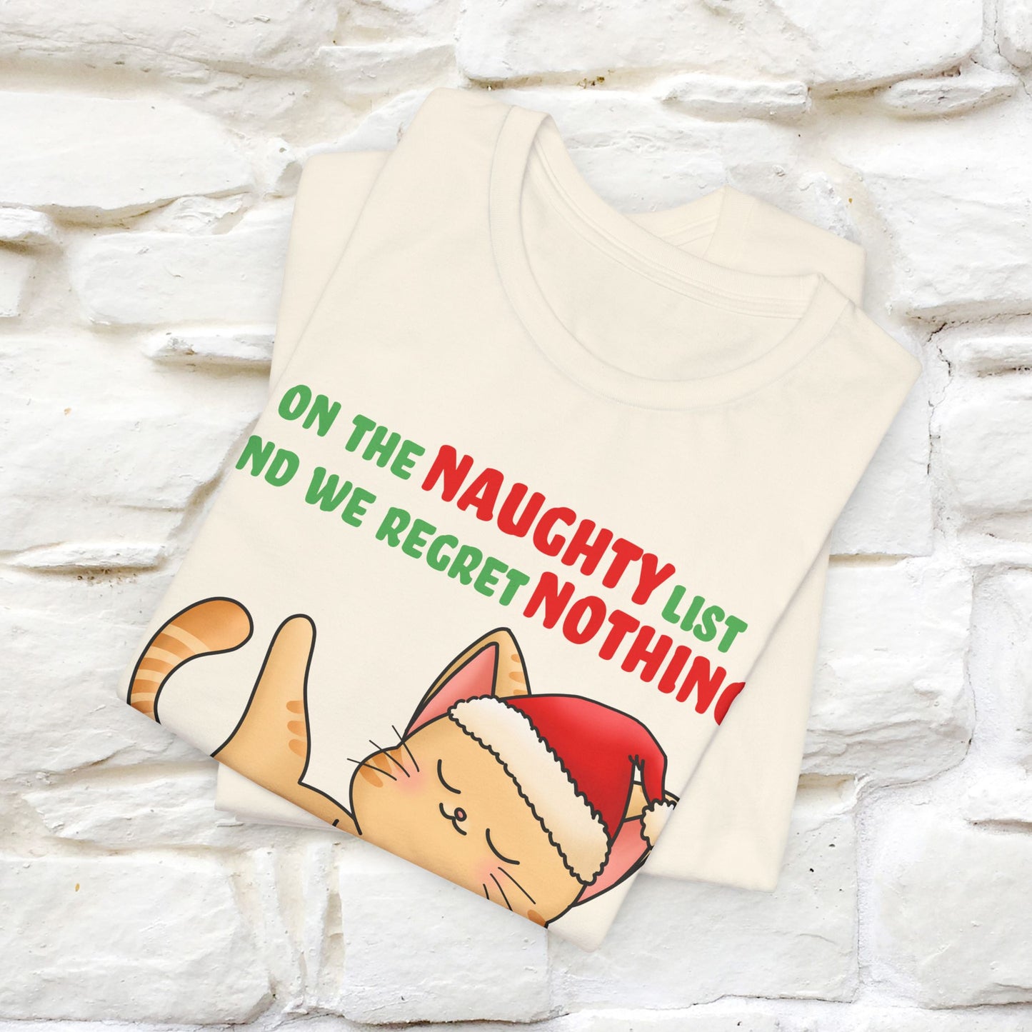 On the Naughty List and We Regret Nothing | Sarcastic Cat Christmas Shirt for Men & Women | 100% Cotton*